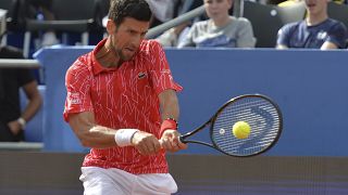 Serbia's Novak Djokovic returns the ball during an exhibition tournament in Zadar, Croatia, Sunday, June 21, 2020.