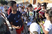 Novak Djokovic, left, talks to children in Zadar, Croatia. Djokovic has tested positive for the coronavirus after organising a tennis tournament in Serbia and Croatia.