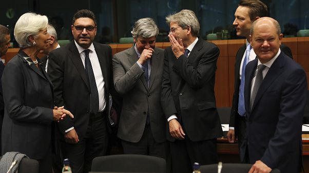 ECB President Christine Lagarde (L) with euro zone finance ministers during a January 2020 Eurogroup meeting. ECB President Christine Lagarde (L) with euro zone finance ministers during a January 2020 Eurogroup meeting.