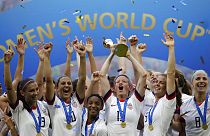 United States' Megan Rapinoe lifts up a trophy after winning the Women's World Cup final soccer match between US and The Netherlands at the Stade de Lyon, France