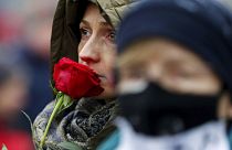 A woman takes parts in a rally on International Women's Day in Warsaw, Poland, Sunday, March 8, 2020