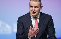 Iceland's President Guoni Johannesson gestures while speaking at a plenary session of the International Arctic Forum in St. Petersburg, Russia, Tuesday, April 9, 2019.