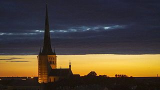 Dusk falls over Estonia's medieval capital, Tallinn, Thursday, June 27, 2019.