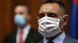 In this Tuesday, April 28, 2020. file photo, Serbia Defense Minister Aleksandar Vulin wearing a mask to protect against coronavirus attends the session in Belgrade, Serbia.