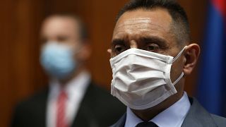 In this Tuesday, April 28, 2020. file photo, Serbia Defense Minister Aleksandar Vulin wearing a mask to protect against coronavirus attends the session in Belgrade, Serbia.