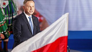 President Andrzej Duda addressees supporters shortly after voting ended in the presidential election in Lowicz, Poland, Sunday, June 28, 2020