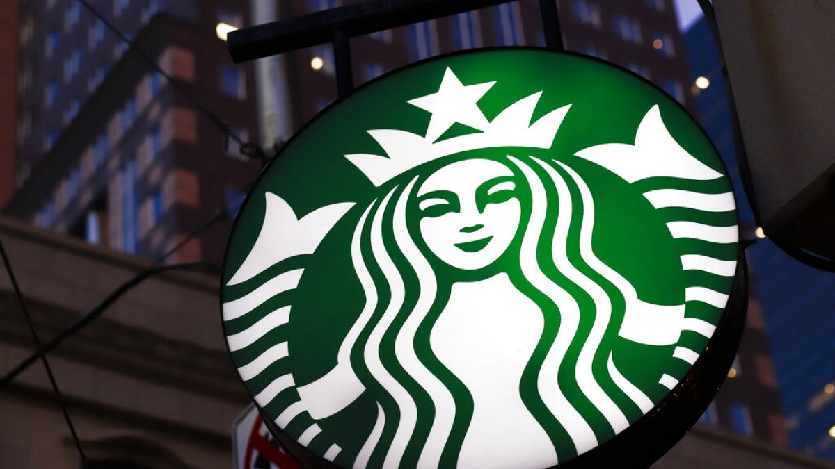 This June 26, 2019, file photo shows a Starbucks sign outside a Starbucks coffee shop in downtown Pittsburgh, US