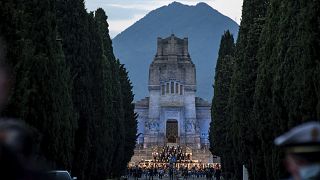 Musicians perform in front of the Bergamo cemetery, Italy, Sunday, June 28, 2020.