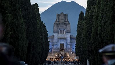 Musicians perform in front of the Bergamo cemetery, Italy, Sunday, June 28, 2020. 