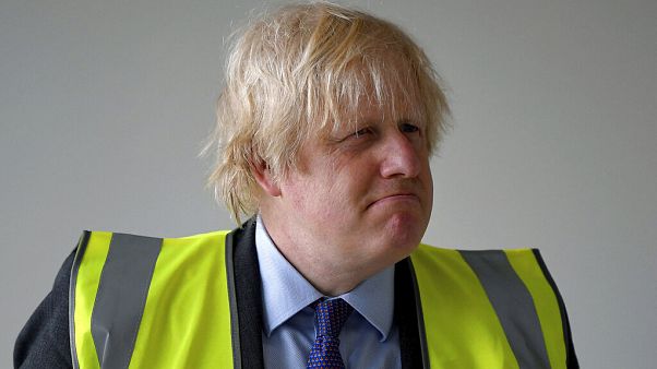 Britain's Prime Minister Boris Johnson visits the construction site of Ealing Fields High School in west London Monday