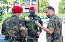 Soldiers of the German forces stay in front of the district hall, headquarters of the task force coordinating coronavirus test stations, in Warendorf, Germany, June 24, 2020.