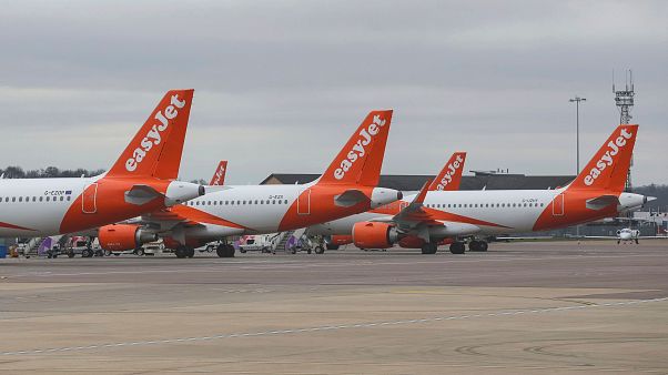 EasyJet planes parked on the tarmac at Luton Airport EasyJet planes parked on the tarmac at Luton Airport