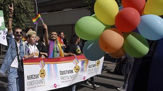 Participants dance during a gay pride march in Podgorica, September 2017.