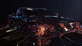 The advert features a sports car melting away to show the e-bike.