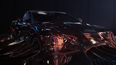 The advert features a sports car melting away to show the e-bike.