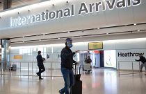 Passengers arrive at Heathrow airport