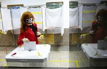 A voter wearing a face mask casts her ballot in Moscow, Russia. Russians vote on a constitutional reform that would allow President Vladimir Putin to stay in power until 2036