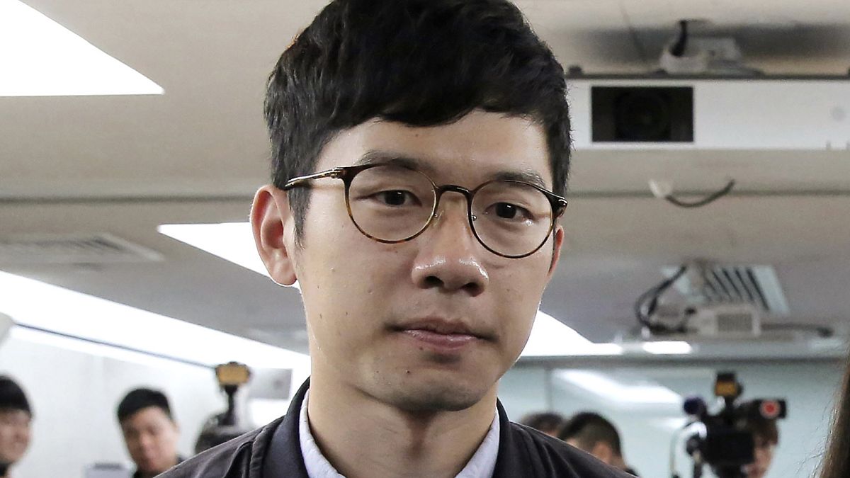 In this Jan. 27, 2018, file photo, pro-democracy activist Nathan Law attends a press conference in Hong Kong. He has now left the city for an undisclosed location.