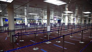 Empty halls in Terminal 2 of Charles de Gaulle international airport are pictured in Roissy, north of Paris, Thursday, May 14 2020. 