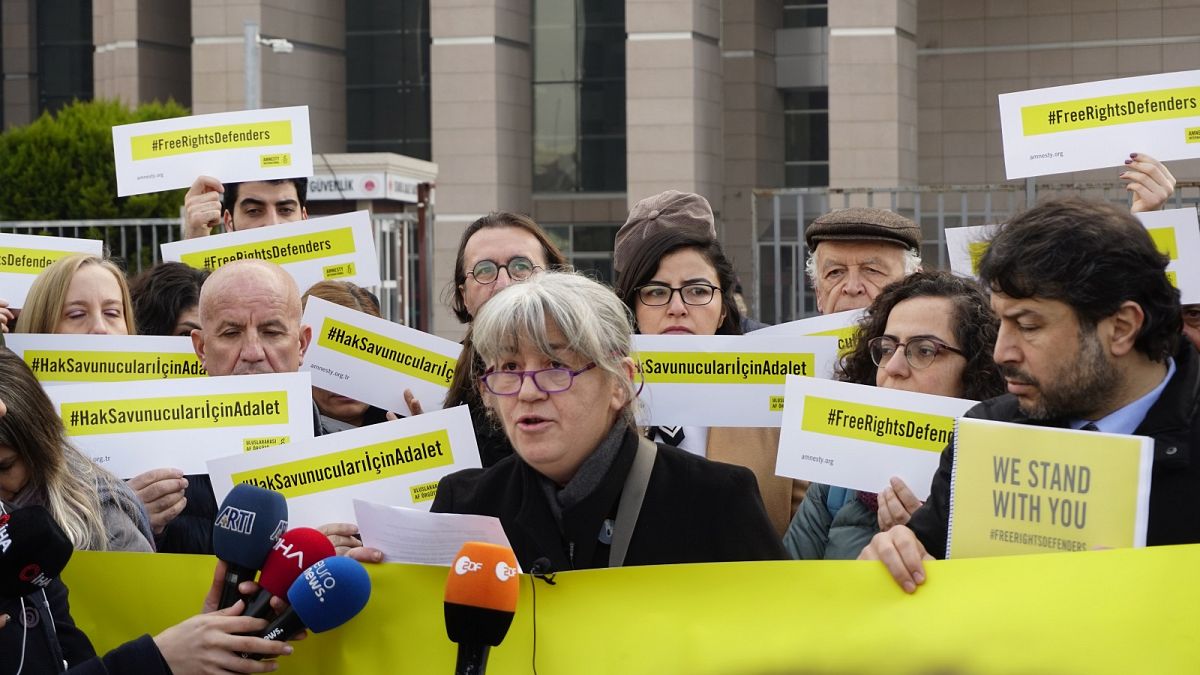Protesters outside a court in Istanbul over the trial of Amnesty International activists