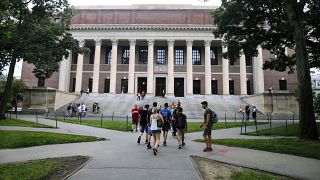 Students walk near the Widener Library in Harvard Yard at Harvard University in Cambridge, Mass. in August 2019.