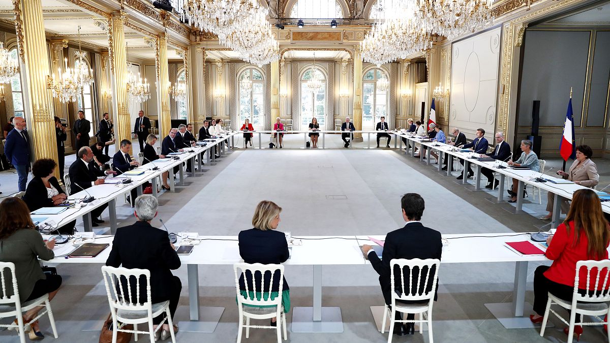 French President Emmanuel Macron (4th-R), Prime Minister Jean Castex (5th-L) and the new ministers at the first cabinet meeting after the government refshuffle, July 8, 2020.