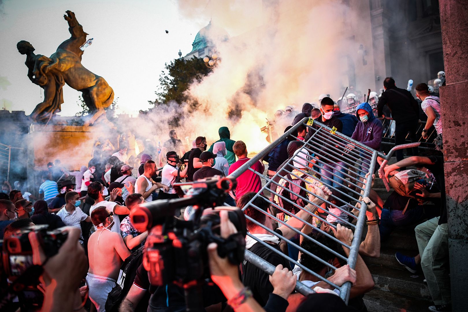 Protesters clash with police in front of Serbia's National Assembly building in Belgrade. July 8, 2020