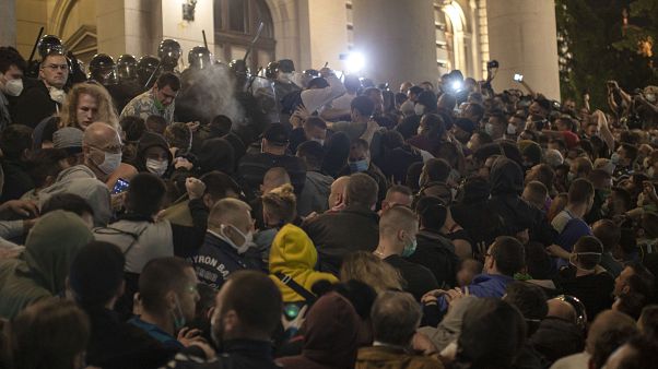 Upset with return of coronavirus curfew, protesters attempt to storm Serbian parliament