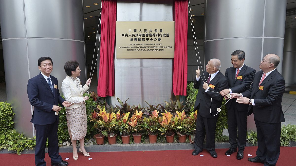 Hong Kong officials including Chief Executive Carrie Lam (second from left) attend th opening ceremony for China's new Office for Safeguarding National Security, July 8, 2020.