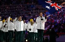 Alex Pullin of Australia carries the national flag as he leads the team during the opening ceremony of the 2014 Winter Olympics in Sochi, Russia