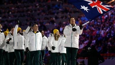 Alex Pullin of Australia carries the national flag as he leads the team during the opening ceremony of the 2014 Winter Olympics in Sochi, Russia