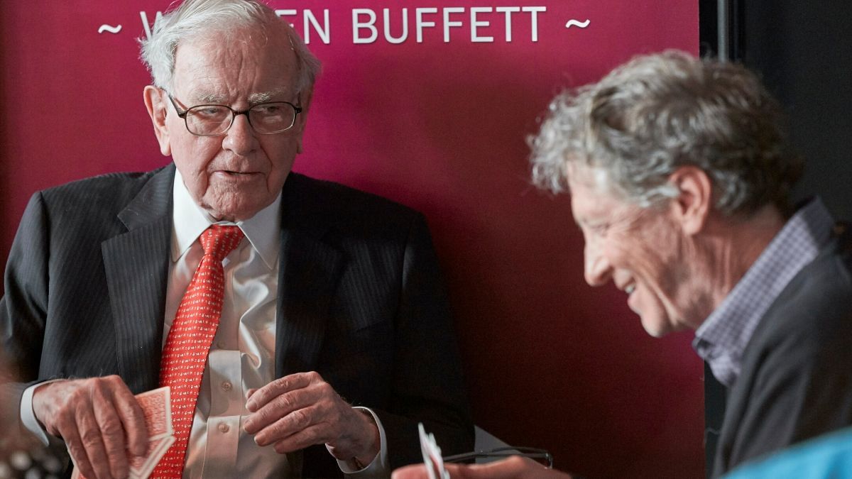 Warren Buffett, Chairman and CEO of Berkshire Hathaway, left, addresses Gill Gates, right, during a game of bridge following the annual Berkshire Hathaway shareholders meeting
