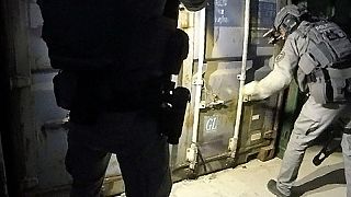 Dutch police raiding the containers on June 22, 2020.