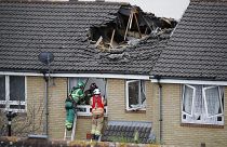 Members of London Fire Brigade assess the damage to a property in Bow, east London on July 8, 2020.