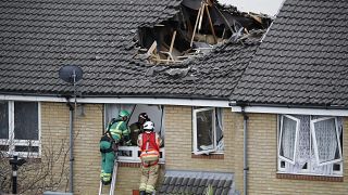 Members of London Fire Brigade assess the damage to a property in Bow, east London on July 8, 2020.