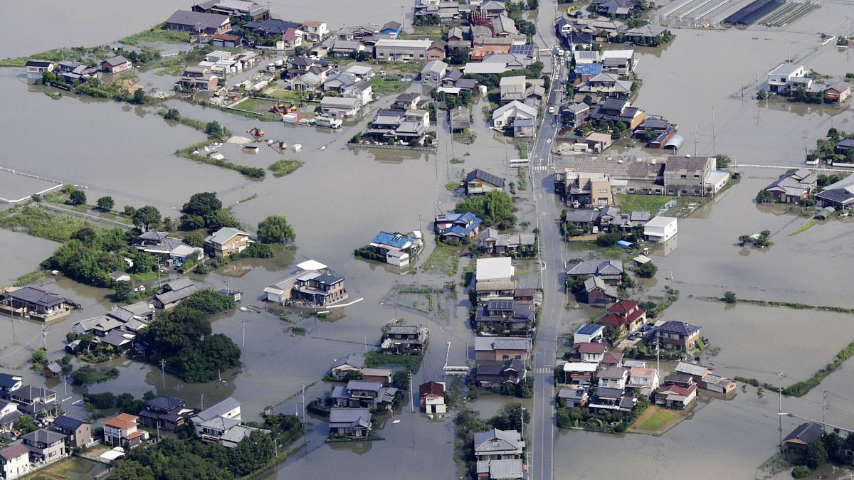 This aerial photo shows the flooded area caused by the swollen Chikugo River, not seen in photo, in Kurume city