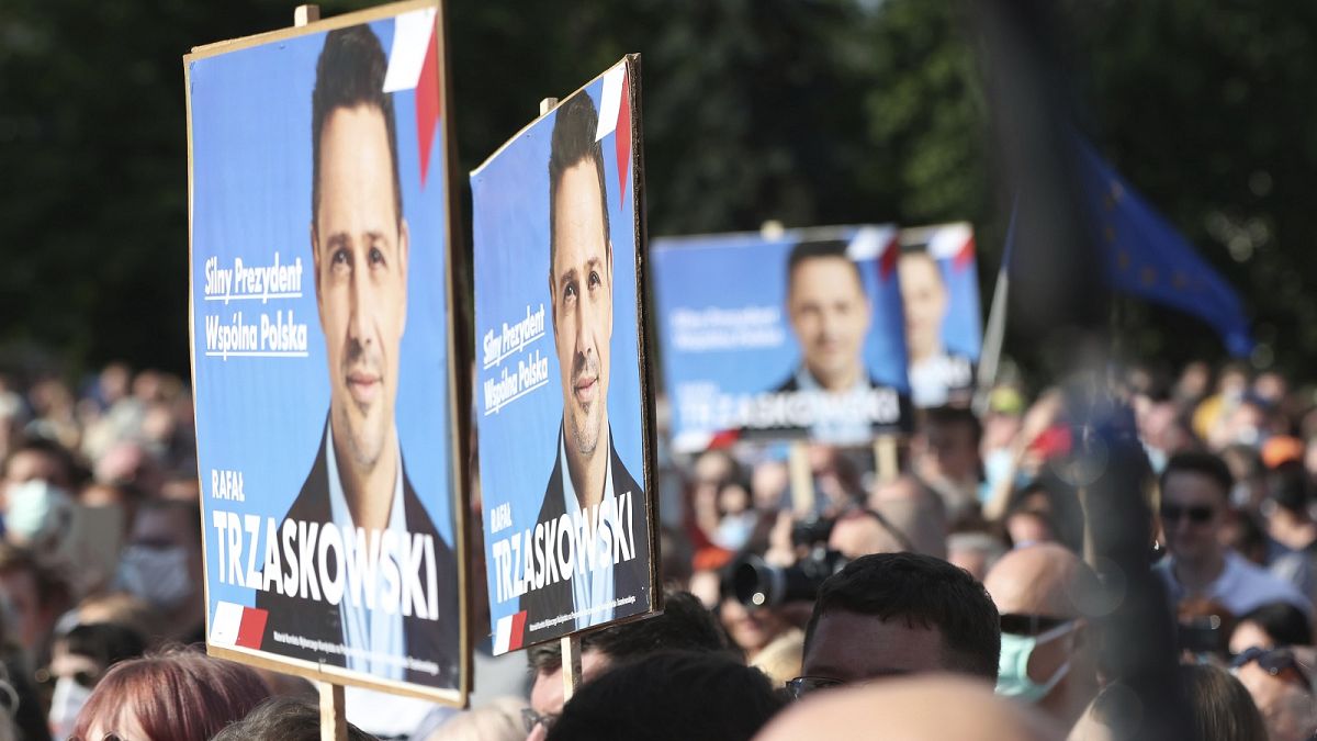 Supporters with banners of Warsaw Mayor and presidential hopeful, Rafał Trzaskowski.