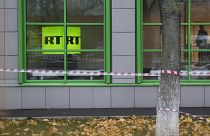 Russian state-owned television station RT logo is seen at the window of the company's office in Moscow, Russia, Friday, Oct. 27, 2017.