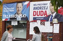 Campaign posters for two contenders in Poland's key presidential election runoff Sunday, in Raciaz, Poland.