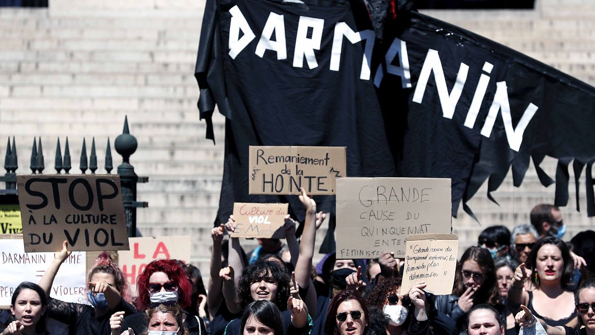 Feminist activists held two small protests Wednesday in Paris following Macron's appointment of an interior minister who has been accused of rape