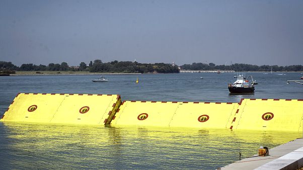 Moveable flood gates rise from the sea in the Venice lagoon, Italy, Friday, July 10, 2020. Moveable flood gates rise from the sea in the Venice lagoon, Italy, Friday, July 10, 2020.