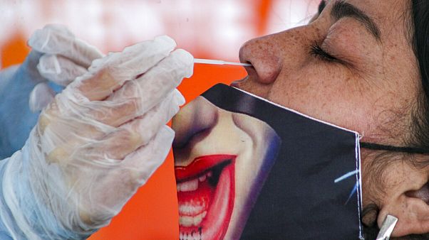 Taking a nasal swab sample in the Puente Alto neighborhood of Santiago, Chile, July 10, 2020 Taking a nasal swab sample in the Puente Alto neighborhood of Santiago, Chile, July 10, 2020