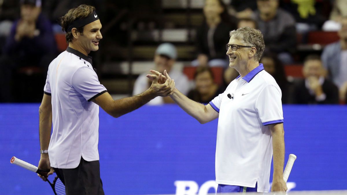 Roger Federer, of Switzerland, left, and Microsoft founder Bill Gates, right