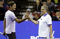 Roger Federer, of Switzerland, left, and Microsoft founder Bill Gates, right