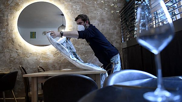 A Hungarian restaurant owner prepares to open in Budapest.