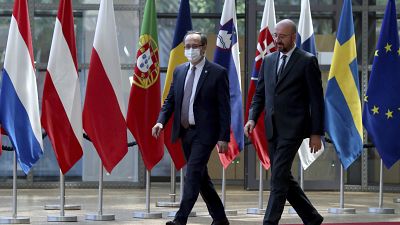 European Council President Charles Michel, right, walks with Kosovo's Prime Minister Avdullah Hoti before a meeting in Brussels in June