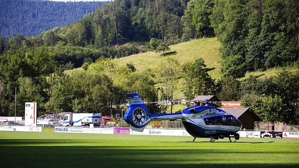 A police helicopter stands on a sports field in Oppenau, southern Germany. A police helicopter stands on a sports field in Oppenau, southern Germany.