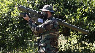Photo, shows a Hezbollah fighter holding an Iranian-made anti-aircraft missile on the border with Israel, in Naqoura, south Lebanon