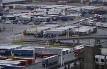 Lorries leave after disembarking a ferry as others wait to board on the morning after Brexit, Saturday Feb 1, 2020.