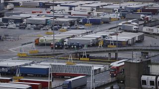 Lorries leave after disembarking a ferry as others wait to board on the morning after Brexit, Saturday Feb 1, 2020.